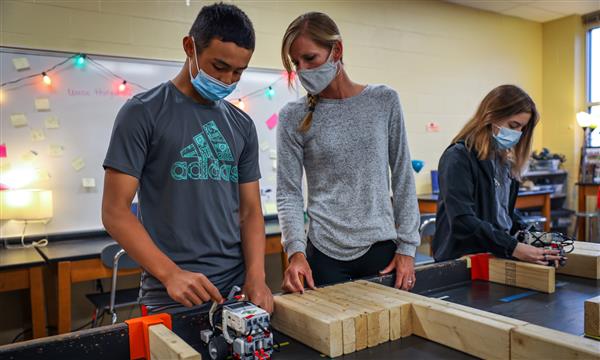 Teacher and student start robot through maze